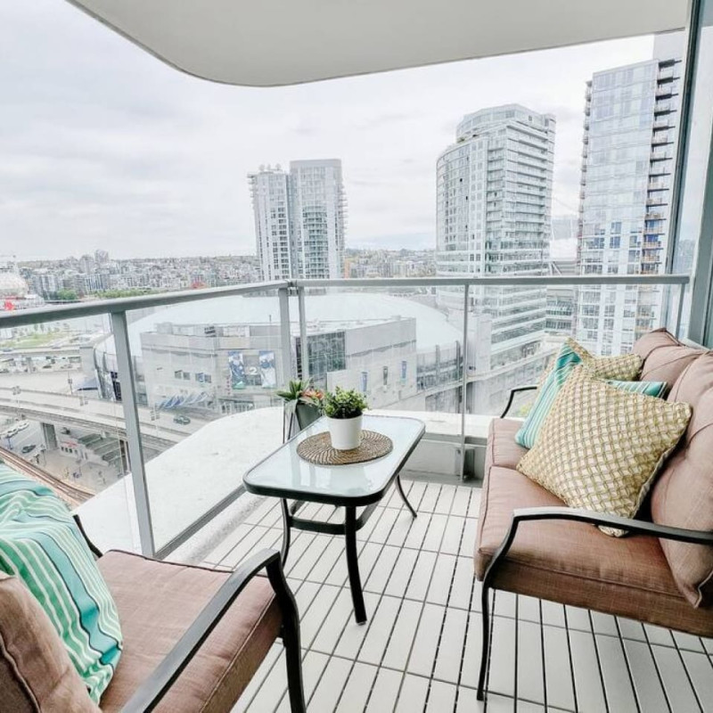 Balcony bliss awaits — relax in your private outdoor retreat overlooking the vibrant Downtown Vancouver skyline. Perfect for morning coffee or sunset unwinding, this cozy space captures the essence of elevated urban living.