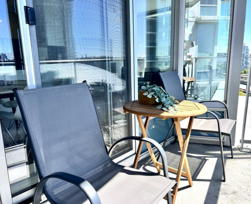 Step onto the private balcony and soak in the sunshine, fresh air, and cityscape views — a peaceful spot to relax and enjoy your Vancouver escape.